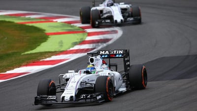 Felipe Massa of Brazil and Williams drives ahead of Valtteri Bottas of Finland and Williams during the British Grand Prix at Silverstone Circuit on July 5, 2015 in Northampton, England. (Photo by Clive Mason/Getty Images)
