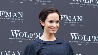 Emily Blunt, in a navy belted dress, attends 'The Wolfman' photocall at Villa Borghese on January 27, 2010 in Rome, Italy. Getty Images