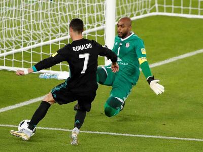 Al Jazira goalkeeper Ali Khaseif saves from Real Madrid’s Cristiano Ronaldo in the first half. Amr Abdallah Dalsh / Reuters