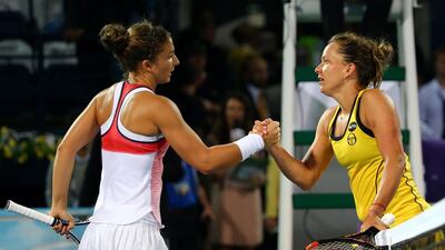 Italian tennis player Sara Errani (L) shakes hands with Czech player Barbora Strycova after beating her in the semi-final WTA tennis match of the Dubai Duty Free Tennis Championships, on February 20, 2016. Sara Errani (ITA) beat Barbora Strycova (CZE) 6-0, 6-2 / AFP / MARWAN NAAMANI