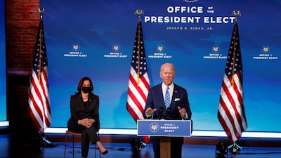 US President-elect Joe Biden delivers remarks as Vice President-elect Kamala Harris looks on during a televised speech at The Queen Theatre in Wilmington, Delaware. Reuters