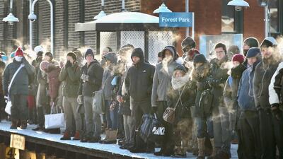 Passengers heading into downtown Chicago, Illinois wait for the train to arrive in below zero temperatures on January 7, 2014. Platforms were crowded and trains were delayed because train doors kept freezing open. Chicago is experiencing its third consecutive day of below zero temperatures. Scott Olson/Getty Images