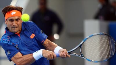 David Ferrer returns the ball to Rafael Nadal. Marwan Naamani / AFP