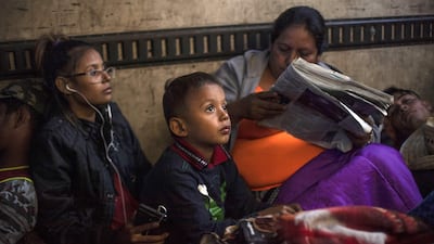Central American migrants travel in a truck from Mexicali to Tijuana, Mexico on November 27, 2018. AFP