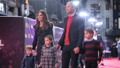 Prince William and Catherine, Duchess of Cambridge with their children, Prince Louis, Princess Charlotte and Prince George, attend a special pantomime performance at London's Palladium Theatre, to thank key workers and their families for their efforts throughout the pandemic, on December 11, 2020 in London, England. Getty Images