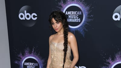 Camilla Cabello, in Oscar de la Renta, arrives at the American Music Awards on Sunday, November 24, 2019, at the Microsoft Theatre in Los Angeles. AFP