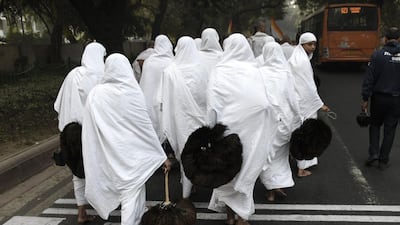 Some Jain devotees vow to renounce the material world, including clothing. Dominique Faget / AFP Photo