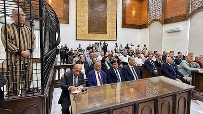 Atif Najib, former political intelligence commander and a maternal cousin of Bashar Al Assad, appears in court in Damascus. AFP