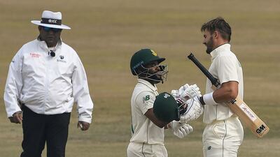 South Africa's Aiden Markram, right, celebrates with teammate Temba Bavuma after reaching his hundred. AFP