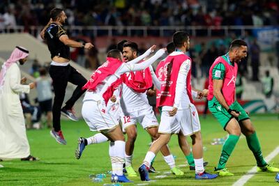 Bahrain players celebrate after their last-gasp victory against India in Sharjah on Monday night. Karim Sahib / AFP