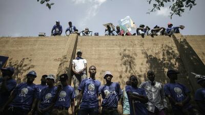 South African main opposition party Democratic Alliance supporters listen to leader Mmusi Maimane addressing thousands of supporters during a march against South African President Jacob Zuma at the Constitutional Court in Johannesburg. South African municipal elections are set to be contested on the 3rd of August. Gianluigi Guercia / AFP