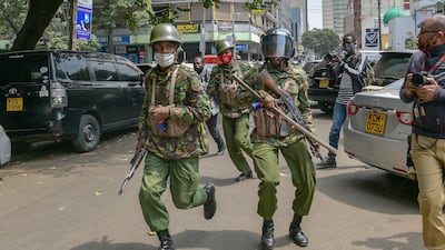 Police officers from the General Service Unit (GSU) charge at protestors taking part in a march to protest against police brutality and harassment, especially against the poor, in Nairobi on July 7, 2020. AFP