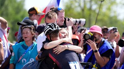 Great Britain's Tom Pidcock is congratulated by his partner Bethany Louise Zajac after the race. PA