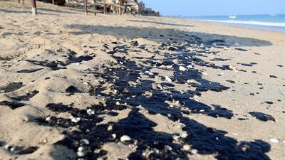 Oil washed up on Al Aqah beach in November 2019. The particles could be seen stretching along the two-kilometre Al Aqah beach and on Dibba beach, 8km to the north. Chris Whiteoak / The National