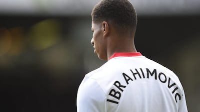 Marcus Rashford adorns a Zlatan Ibrahimovic replica shirt in support for the striker after his crucial knee ligament injury. Oli Scarff / AFP