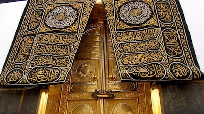Muslim pilgrims touch the golden door of the Kaaba as they pray ahead of Hajj in Makkah, Saudi Arabia. AP