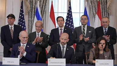 Israel's ambassador to the US Yechiel Leiter, US State Department counsellor Daniel Holler and Lebanese ambassador to the US Nada Hamadeh sign a framework agreement at the State Department in Washington. Reuters
