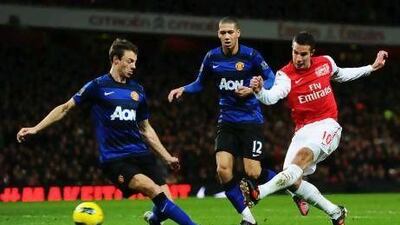 Robin van Persie, right, in action for Arsenal against Manchester United last season, will wear United colours this season.