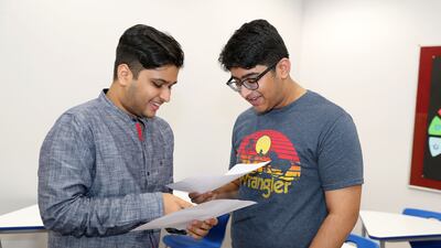 Jay Sunil Goenka, left, and Sumanyu Tonapi are happy after receiving their IB results.