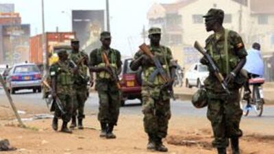 Ugandan military personnel patrol the streets in the Natete neighbourhood of the capital Kampala.