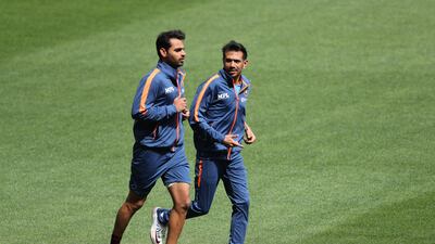 Yuzvendra Chahal and Bhuvneshwar Kumar run before the start of a practice session. AFP