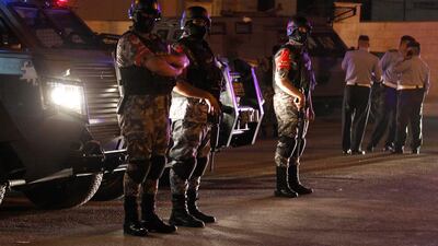 epaselect epa06105854 Jordanian security forces stand infront of their armored vehicle next to the Israel embassy, in Amman, Jordan, 23 July 2017. Media reports state that one person is dead and one injured following an attack on the Isaeli embassy in the Jordanian capital. EPA/AHMAD ABDO