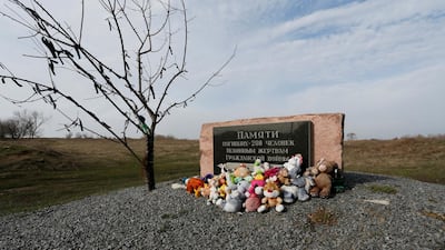 Toys are placed at a memorial to victims of the Malaysia Airlines Flight MH17 plane crash near the village of Hrabove in Donetsk region, Ukraine, on March 9, 2020. Reuters