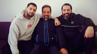 Ahmed Farhat, centre, was 66 when he was shot dead near his home in southern rural Damascus last year. His son Saeed, left, is seeking accountability from Syrian authorities for his father's killing. Photo: Supplied