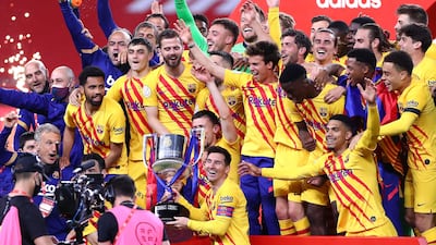 Barcelona's Lionel Messi lifts the trophy after winning the Copa Del Rey final against Athletic Bilbao. Getty
