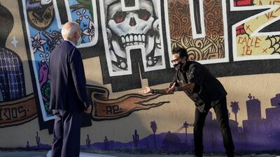 Chef Silvana Salcido Esparza reacts as US Democratic presidential candidate Joe Biden visits her restaurant during a small business bus tour while campaigning in Phoenix, Arizona, US. Reuters