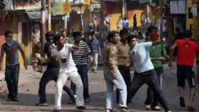In a separate incident in the area, demonstrators throw stones at police during a protest in Jammu, which borders Kashmir today. The protest was against the government for backing down from transferring forest land to a Hindu shrine.