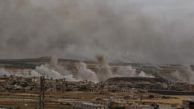 Plumes of smoke rise following reported Syrian government forces' bombardment on the town of Khan Sheikhun in the southern countryside of the militant-held Idlib province, on June 5, 2019. AFP
