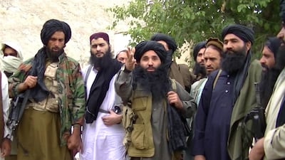 An undated handout video grab file taken from footage released by the Tehrik-e-Taliban Pakistan (TTP) in 2014 shows its head Mullah Fazlullah (C) at an undisclosed location at the Pakistan-Afghan border. EPA
