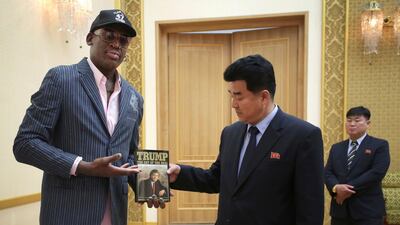 Former NBA basketball star Dennis Rodman presents copy of Donald Trump's The Art of the Deal to North Korea's Sports Minister Kim Il Guk in Pyongyang, North Korea. AP Photo/Kim Kwang Hyon