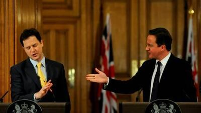The British prime minister, David Cameron, right, with the deputy prime minister, Nick Clegg, at a joint news conference in London.