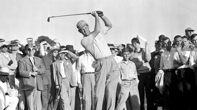 In this April 8, 1955 file photo, Cary Middlecoff takes a shot from the 15th fairway during second round of Masters Golf Tournament. Middlecoff won the Masters by seven shots, which at the time was the largest margin of victory. (AP Photo/Horace Cort, File)