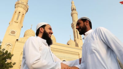 People greeting each other after prayers at the Jumeirah Mosque in Dubai. Pawan Singh / The National