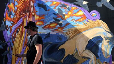 Artist Ruben Poncia, from the Netherlands, gives the final touch at the Dubai 3D Art Festival at the Dubai City Walk in Dubai. Satish Kumar / The National