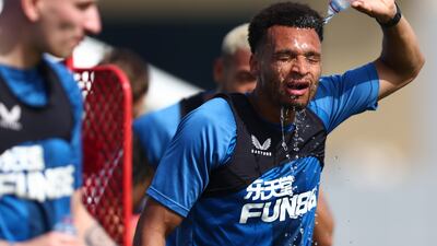Newcastle United's Jacob Murphy takes a water break during training at Nad Al Sheba Sports Complex in Dubai on March 22, 2022. All images from Getty