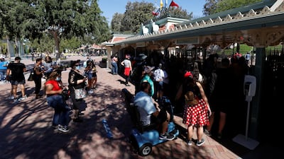 People wait to get inside Disneyland Park on its reopening day amidst the Covid outbreak, in Anaheim, California, US, April 30, 2021. Reuters