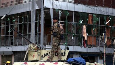 Afghan security officials inspect a scene of militants attack on the finance department building in Jalalabad, Afghanistan, on May 13, 2018. At least nine persons were killed and more than 40 injured after six militants attacked the government building. Ghulamullah Habibi / EPA