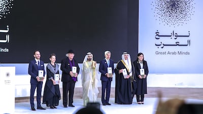 Sheikh Mohammed with the Great Arab Minds award winners. Victor Besa / The National