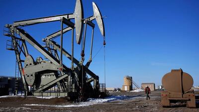 A man walks onto an oil drilling pump site in McKenzie County outside of Williston, North Dakota. Reuters