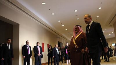 Bahraini Foreign Minister Khalid bin Ahmed al-Khalifa (C) is received by his Jordanian counterpart Ayman Safadi pose (R) before the Ministerial Consultative meeting held in the Dead Sea. EPA