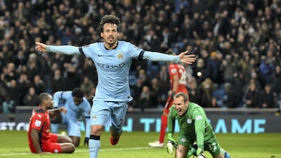 Manchester City midfielder David Silva celebrates scoring in the Premier League against Leicester City in 2015. AFP