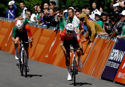 China's Li Guo, right, won gold in the women's road race, with Afghanistan's Fariba Hashimi, left, taking silver. Reuters