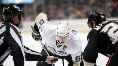 Sidney Crosby, centre, is leading the way as his Penguins find their top form. Mark Samala / CP