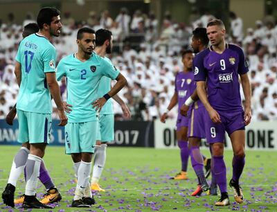 Al Ain forward Marcus Berg, right, was substituted on 69 minutes against Al Hilal. Karim Sahib / AFP