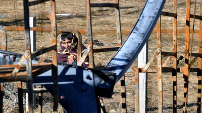 A migrant prepares to leave migrant camp Lipa. The camp was used to shelter about 1300 illegal migrants. AFP