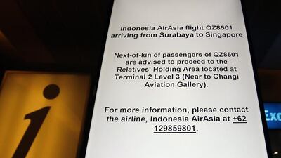 An electronic sign directs the relatives of the passengers of missing Air Asia flight QZ 8501 to a holding area at the Changi Airport in Singapore. The flight was on its way to Singapore from Surabaya and was reported missing by Indonesian air authorities over the Indonesian islands of Tanjung Pandan and Pontianak. Wallace Woon / EPA